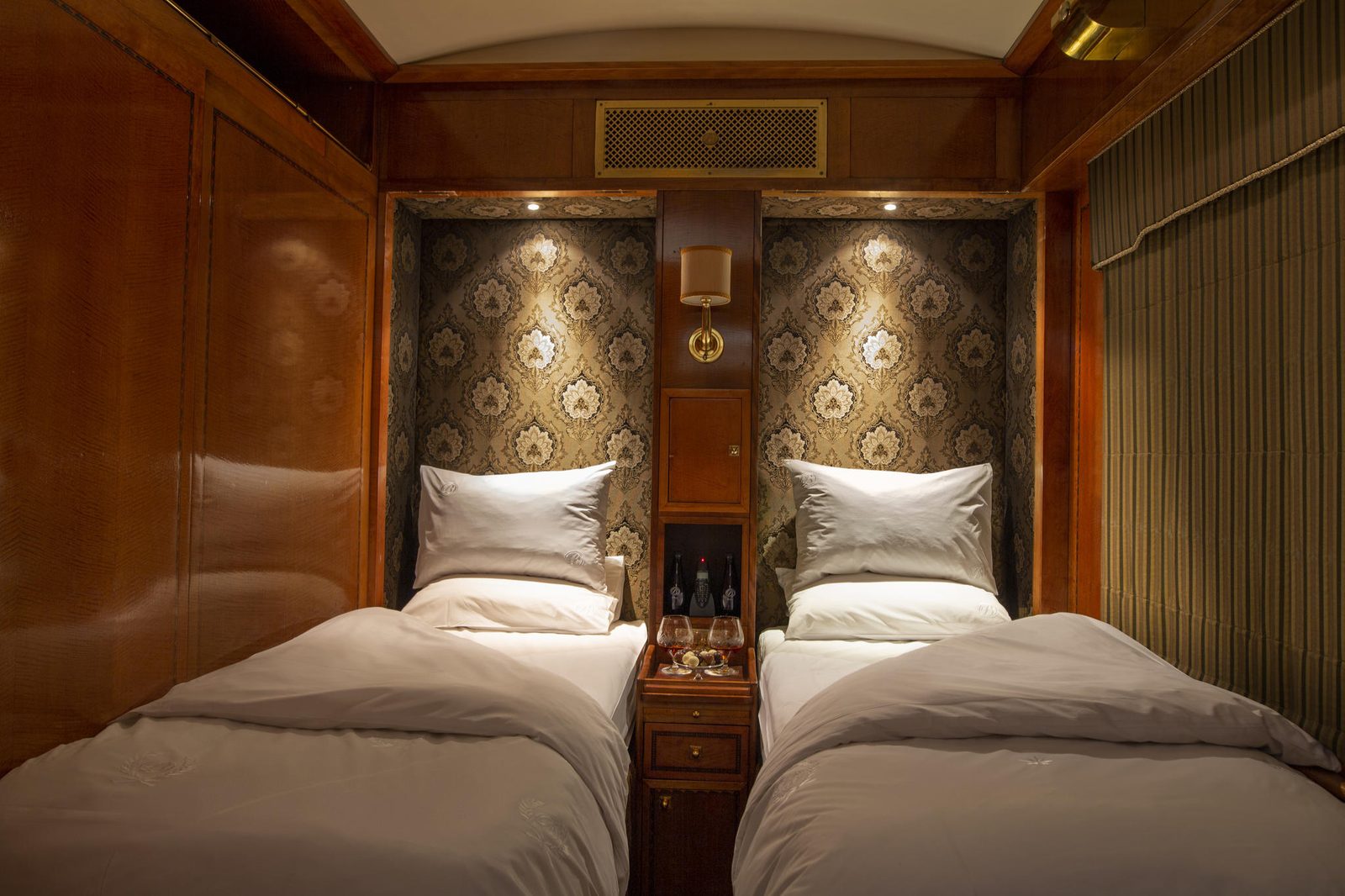 A twin-bed suite in the evening